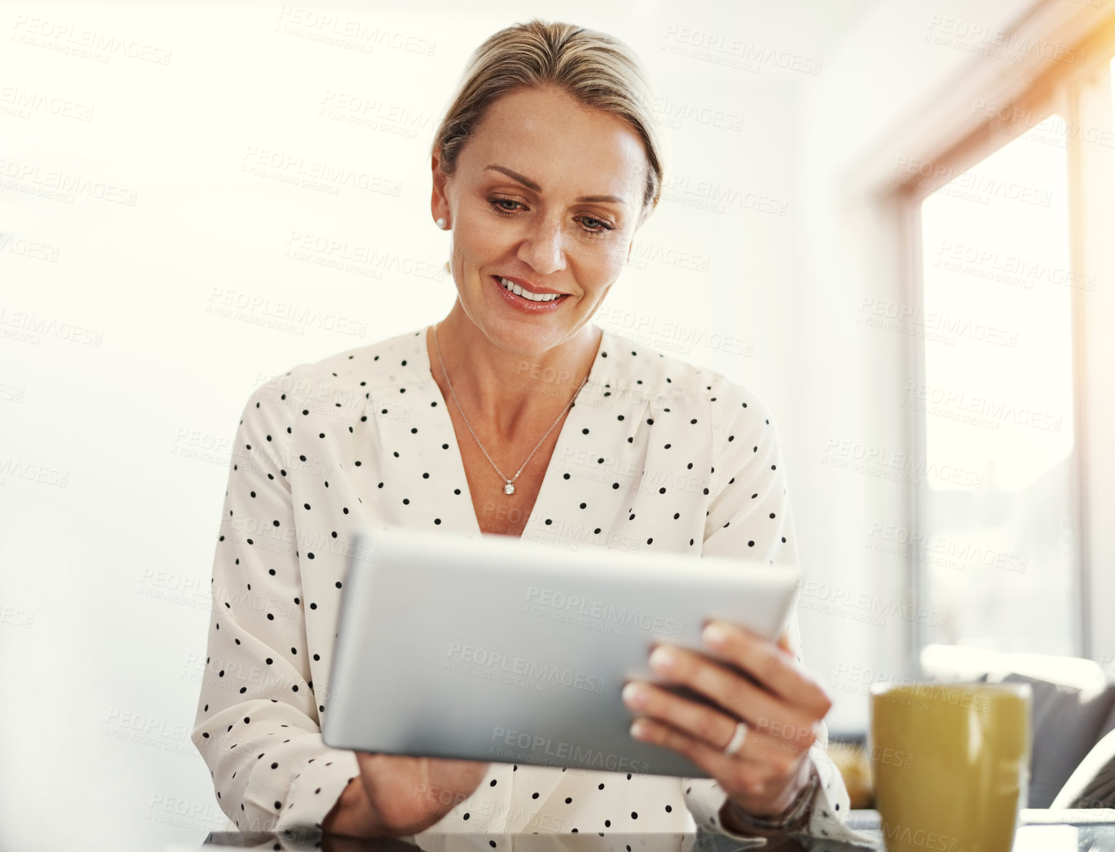 Buy stock photo Cropped shot of a mature businesswoman working from her home office