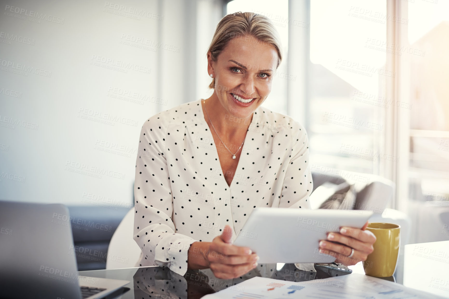 Buy stock photo Cropped shot of a mature businesswoman working from her home office