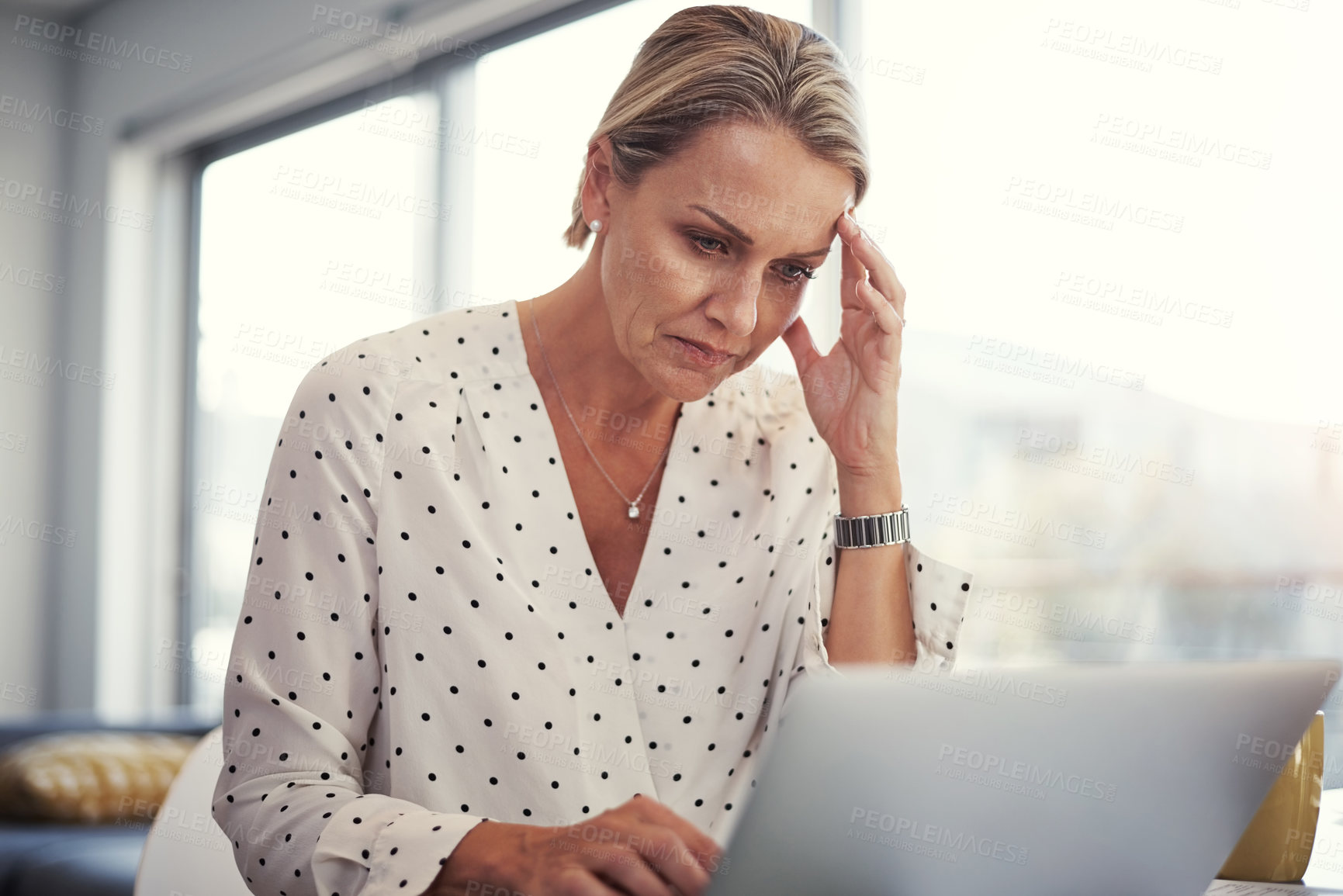 Buy stock photo Cropped shot of a mature businesswoman working from her home office