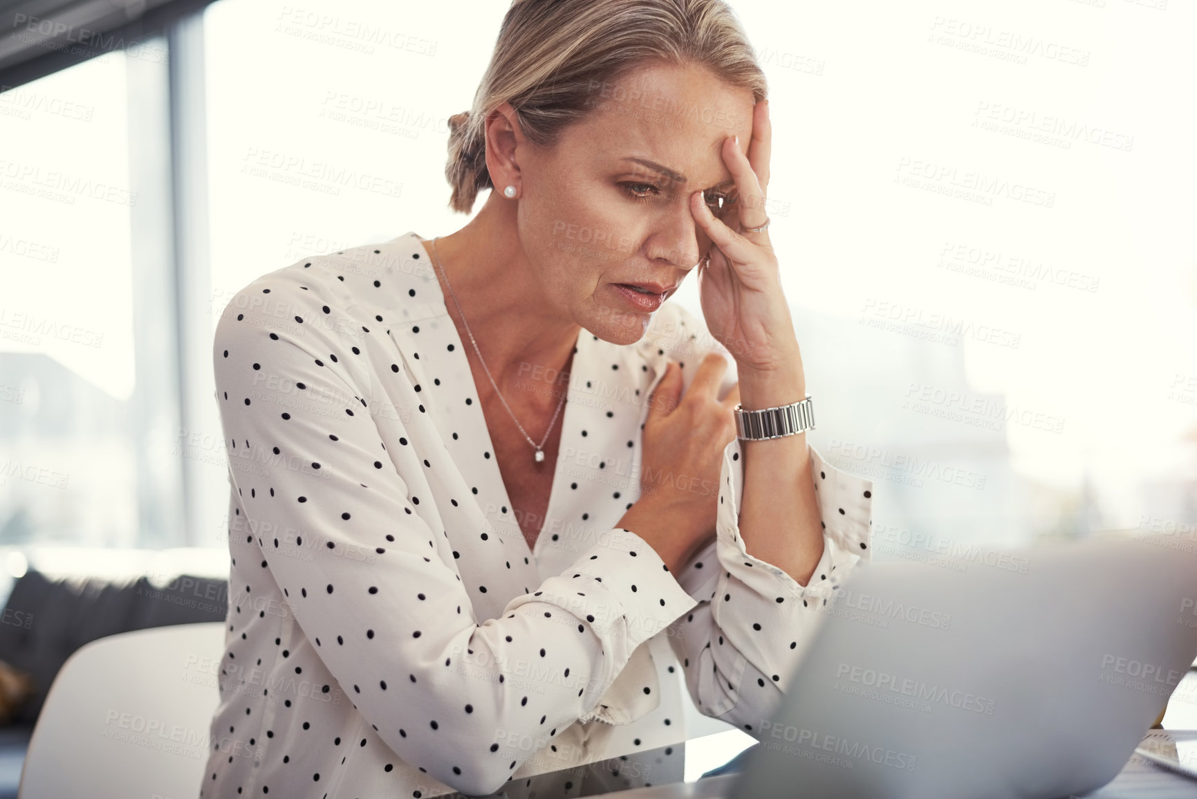 Buy stock photo Cropped shot of a mature businesswoman working from her home office