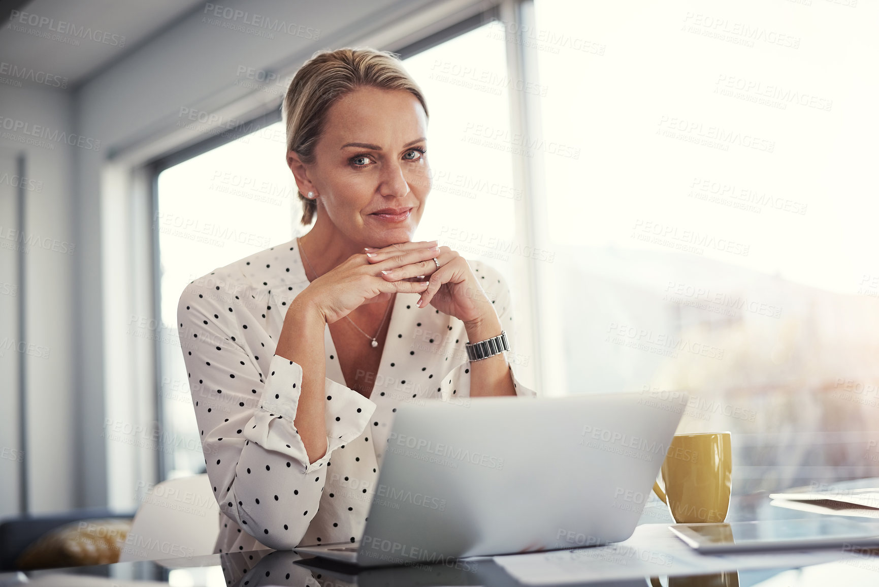 Buy stock photo Cropped shot of a mature businesswoman working from her home office