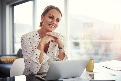 Buy stock photo Cropped shot of a mature businesswoman working from her home office