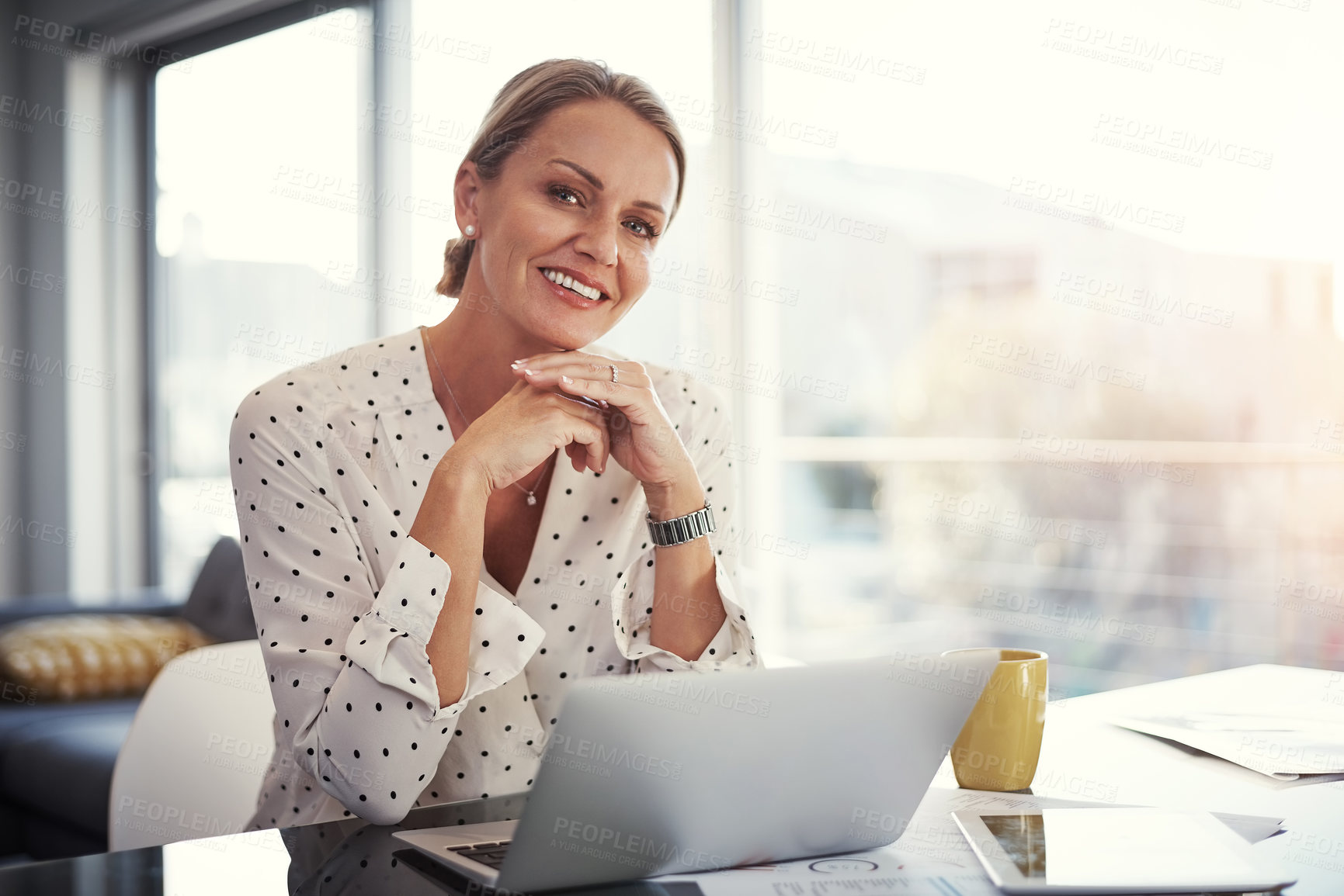 Buy stock photo Cropped shot of a mature businesswoman working from her home office