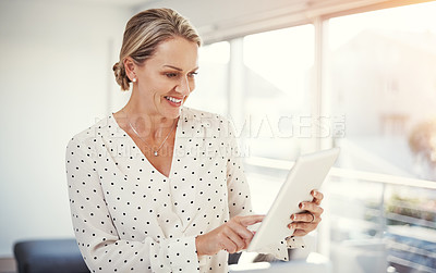 Buy stock photo Cropped shot of a mature businesswoman working from her home office