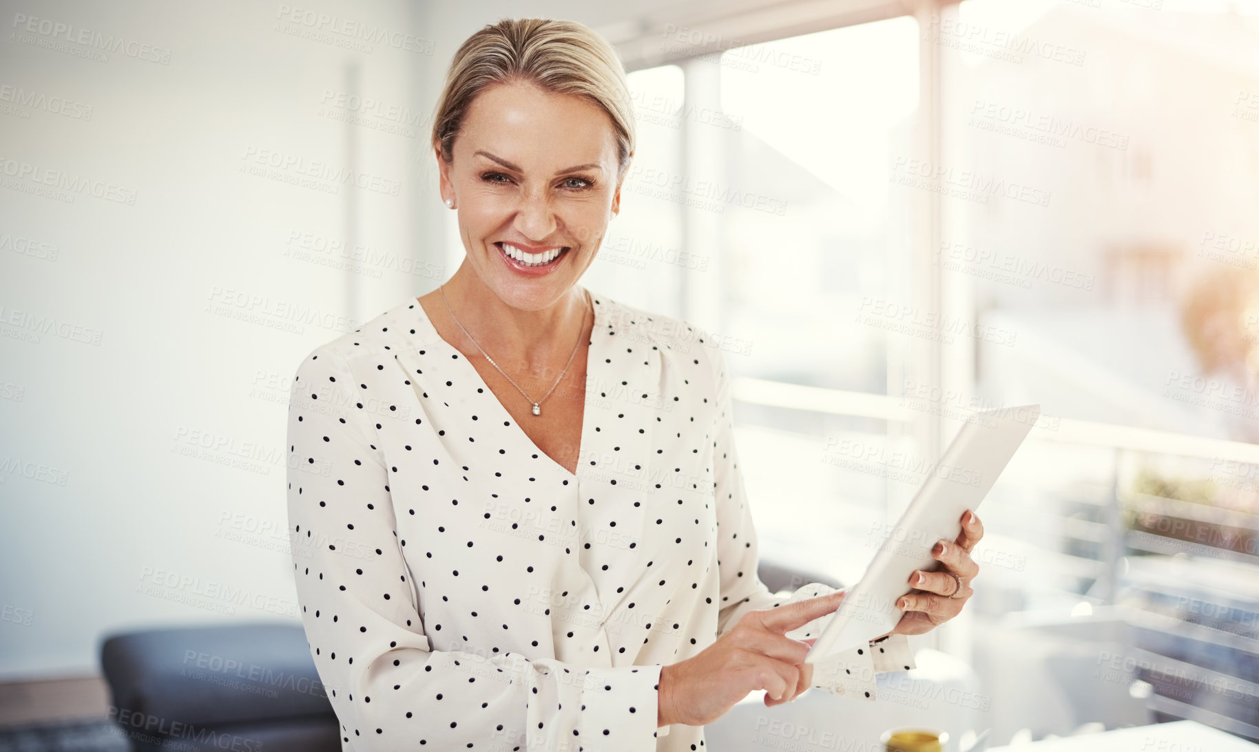 Buy stock photo Cropped shot of a mature businesswoman working from her home office