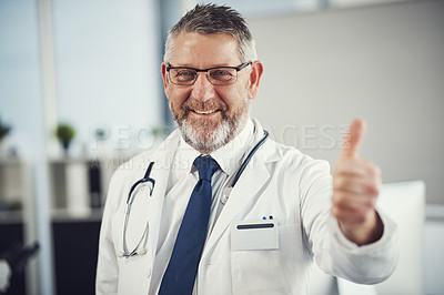 Buy stock photo Portrait of a confident and mature showing thumbs up in his office