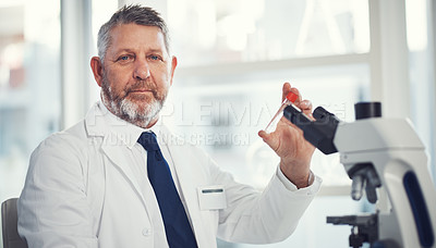 Buy stock photo Portrait of a mature man conducting medical research in a laboratory