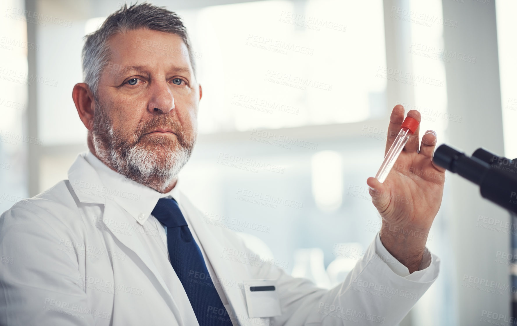 Buy stock photo Portrait of a mature man conducting medical research in a laboratory