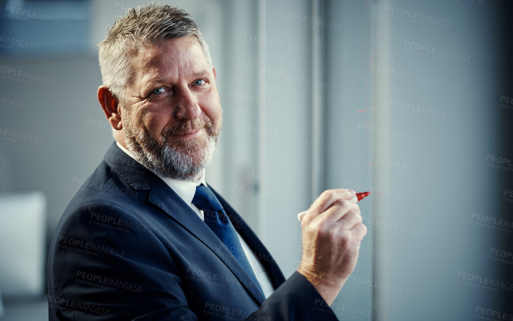 Buy stock photo Portrait of a mature businessman having a brainstorming session against a glass screen in a modern office