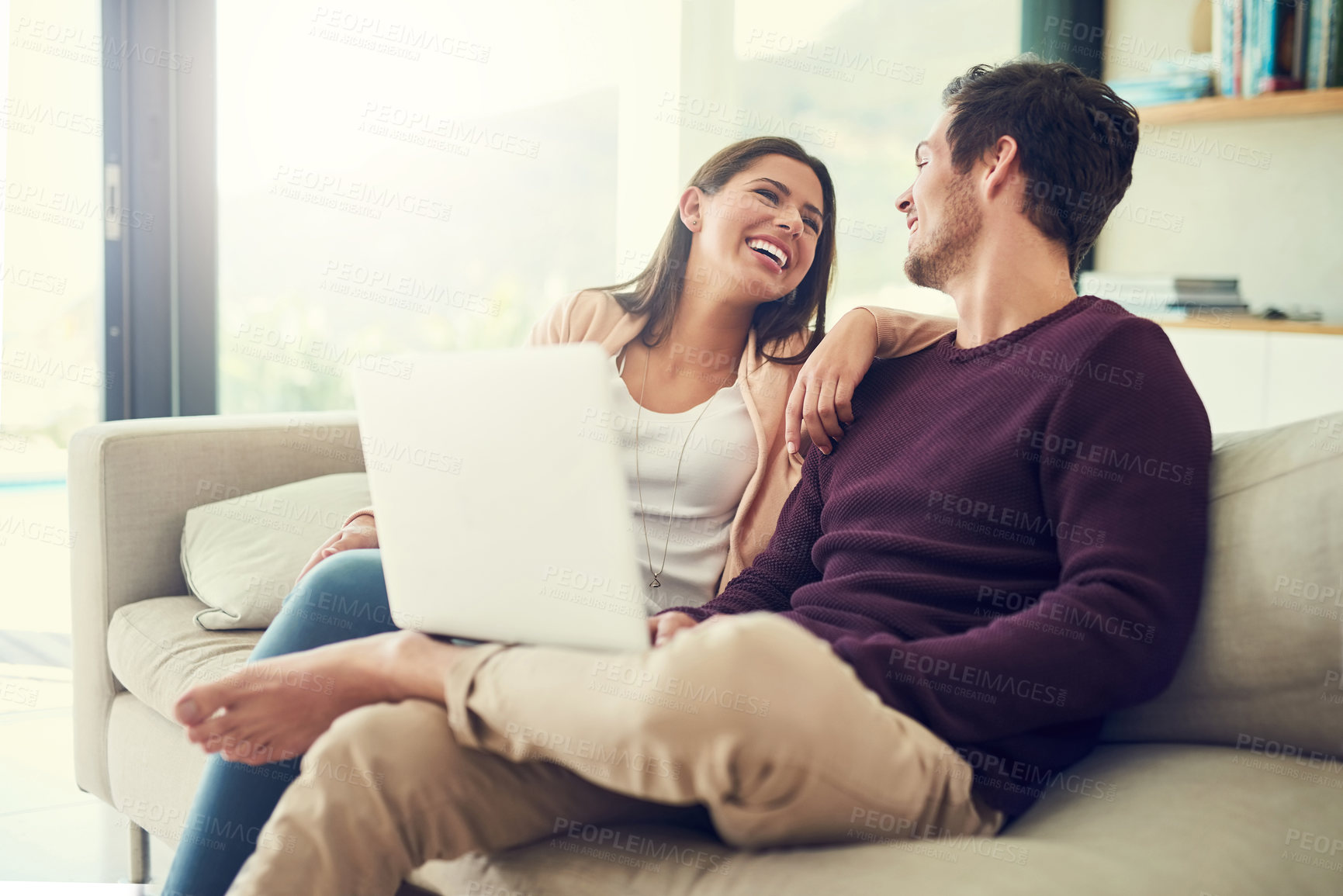 Buy stock photo Laptop, laughing and couple in lounge for movie, show or film entertainment together at home. Happy, love and people relax on sofa and streaming funny or comedy video on computer in living room.