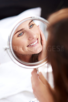 Buy stock photo Face, skincare and girl with mirror reflection for self care, wellness and healthy skin in home. Female person, glowing and facial routine in morning with treatment or cosmetics and inspection
