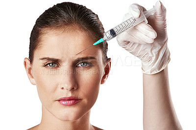 Buy stock photo Woman, portrait and hand with needle for forehead wrinkles or filler face lift, beauty or white background. Female person, injection and skincare procedure for plastic surgery, studio or cosmetics