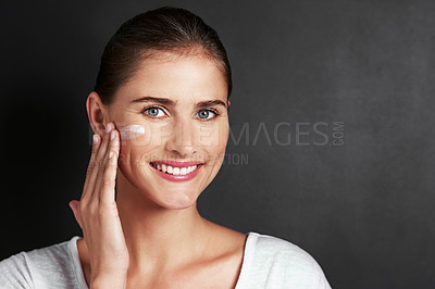 Buy stock photo Mockup, skincare and woman in portrait with moisturizer for face, care and healthy skin in studio background. Female person, facial routine or glow in morning with treatment or cosmetics and smile