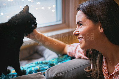 Buy stock photo Woman, black cat and petting with smile in home, scratch and support animal or companion for love. Female person, relax and peace in living room to stroke pet, bonding and connection for loyalty