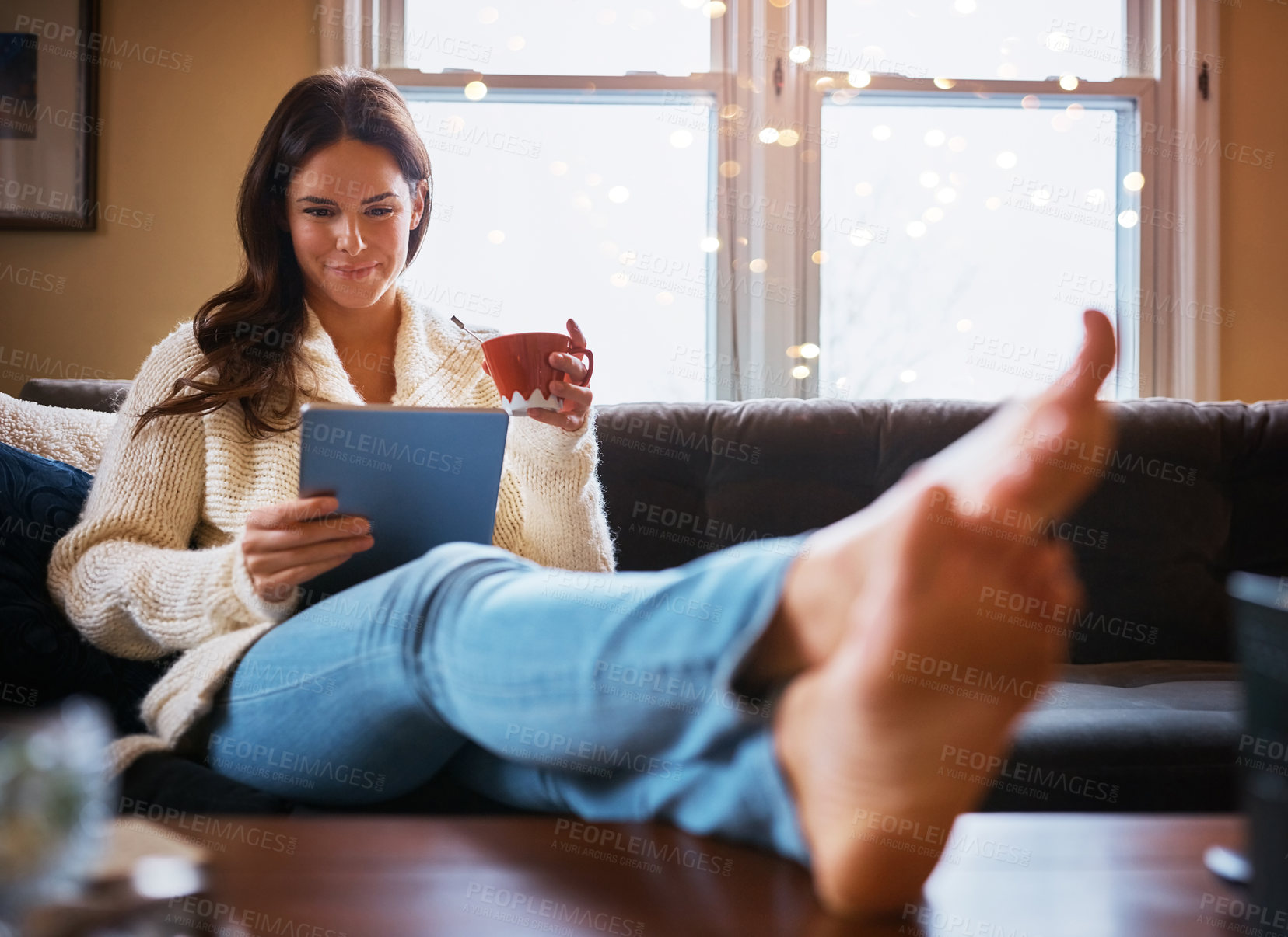 Buy stock photo Relax, tablet and woman with coffee on sofa for news article, social media or communication in living room. Connection, online and person with cup for reading ebook, blog or browsing internet in home