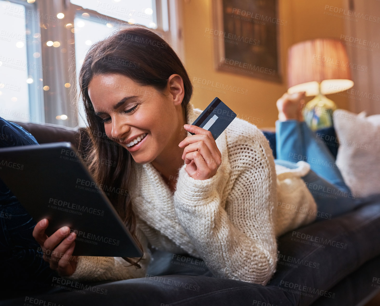 Buy stock photo Woman, excited and tablet with credit card on sofa for online shopping, payment and saving plan. Female person, home and living room on couch with smile for internet banking, investment and discount