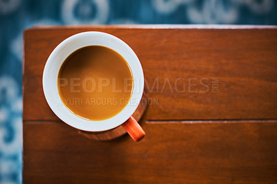 Buy stock photo High angle shot of a cup of coffee on a table