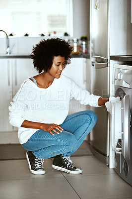 Buy stock photo House, loading and black woman with laundry machine for washing, clothes or fabric and housework. Home, domestic work and happy girl with equipment for chores, household and electric appliance