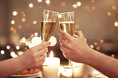 Buy stock photo Cheers, toast and celebration with a couple on a romantic date for their engagement, anniversary or honeymoon. A candle lit dinner with wine glasses in the hands of a man and woman in a restaurant
