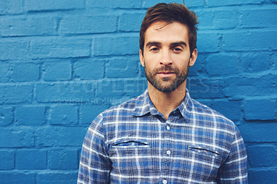Buy stock photo Man, serious in portrait and relax against wall background, casual fashion and cool with blue aesthetic. Confidence, pride and model in checkered shirt, style and lumberjack outfit in Australia