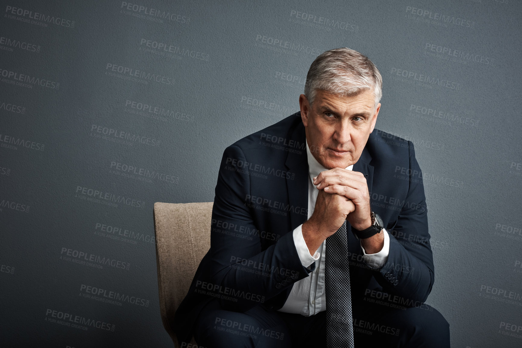 Buy stock photo Studio shot of a mature businessman posing against a grey background