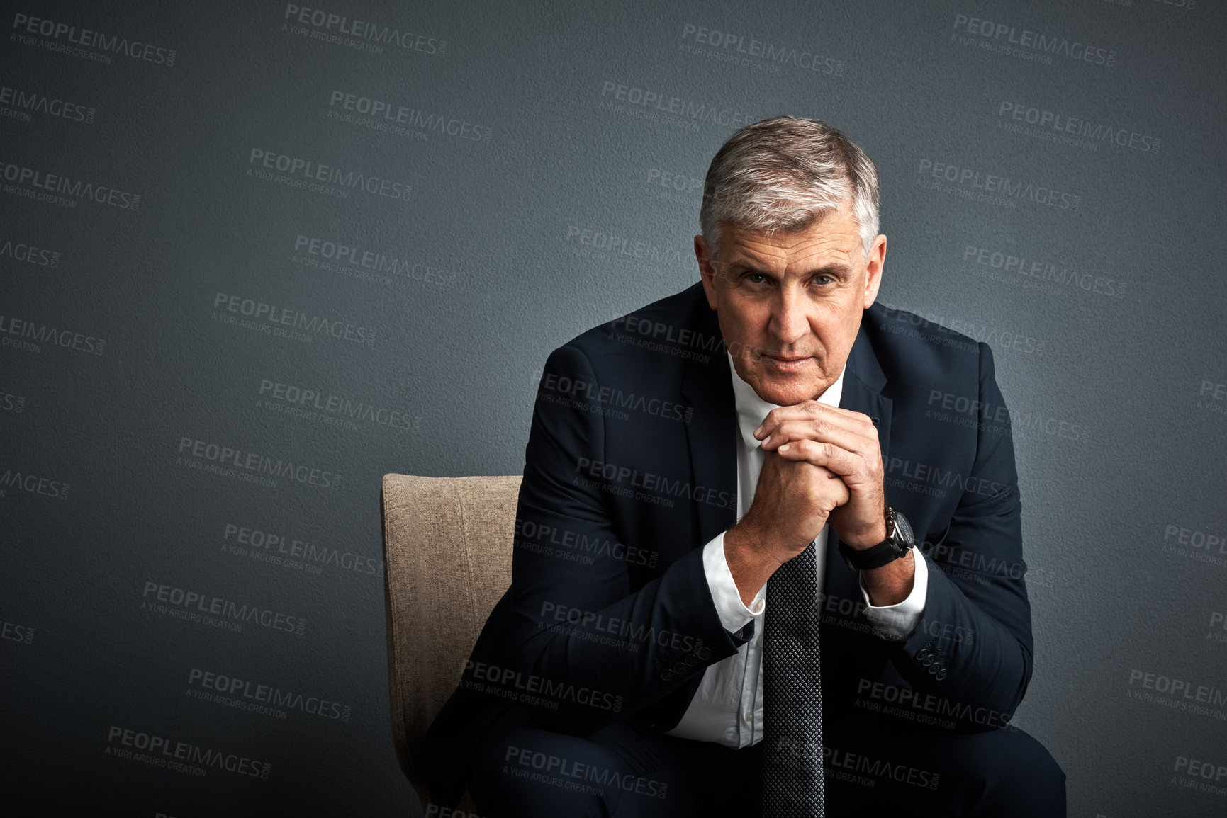 Buy stock photo Studio shot of a mature businessman posing against a grey background