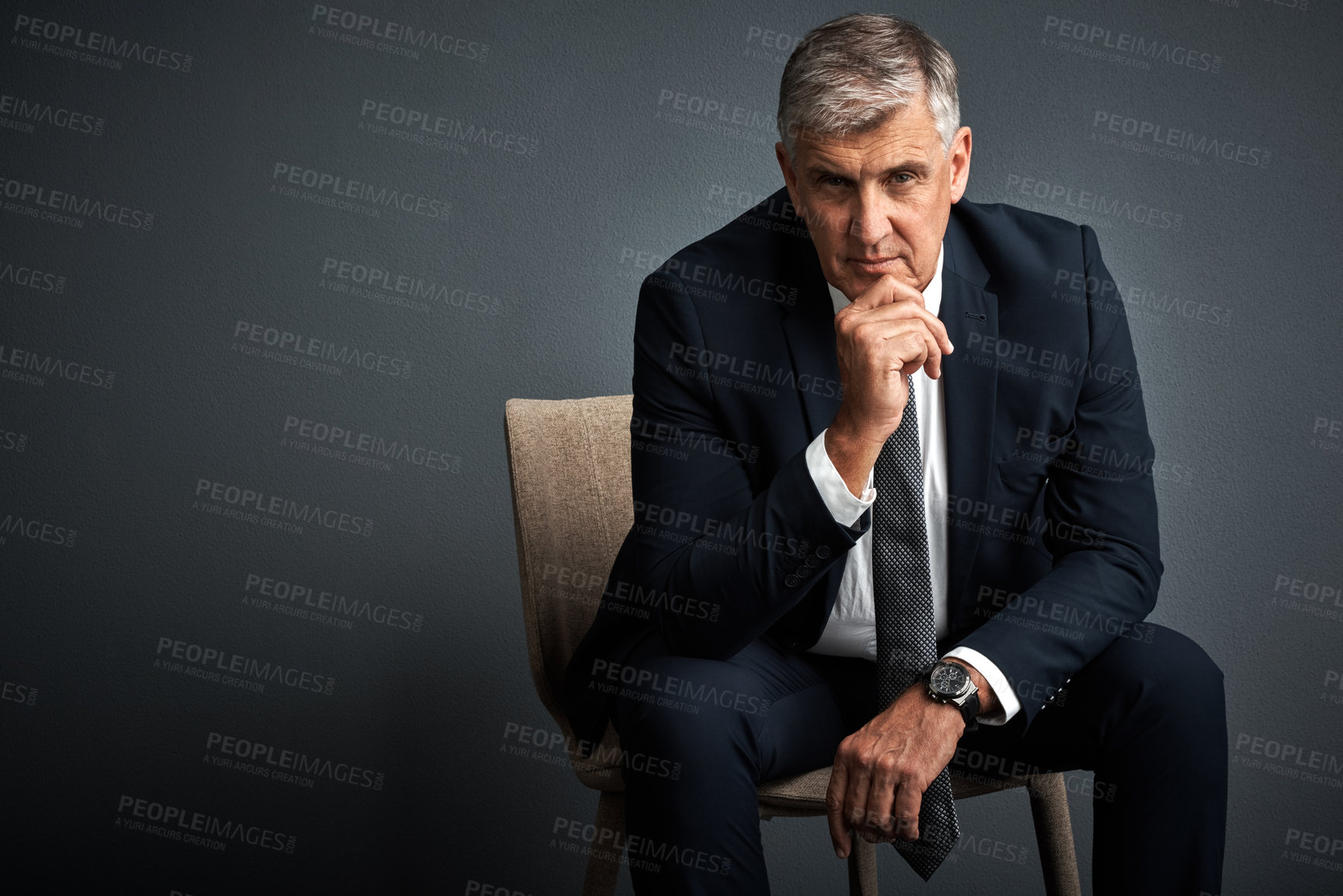 Buy stock photo Studio shot of a mature businessman posing against a grey background