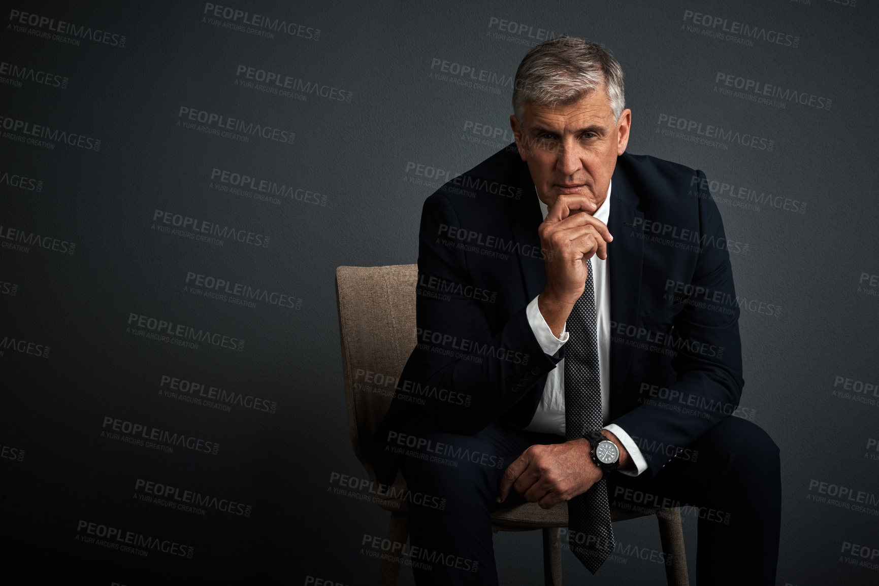 Buy stock photo Studio shot of a mature businessman posing against a grey background