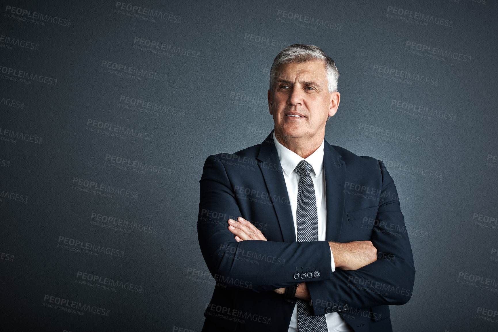 Buy stock photo Studio shot of a mature businessman posing against a grey background