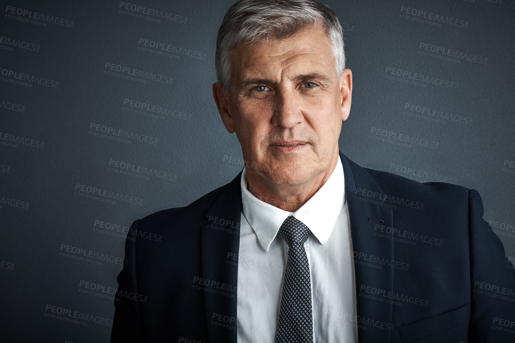 Buy stock photo Studio shot of a mature businessman posing against a grey background