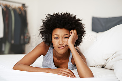 Buy stock photo Portrait, bed and black woman waking up, bored and upset with fatigue, lazy and unhappy at home. Face, female person and girl in the bedroom, frustrated and tired with a headache, depressed and sad