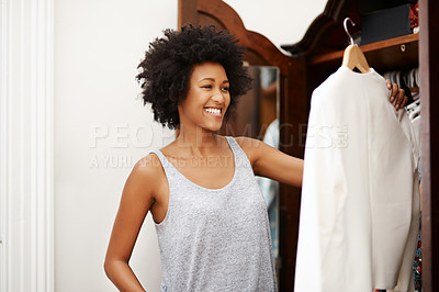Buy stock photo Black woman, smile and clothes choice at wardrobe in home, getting ready and morning preparation. Closet, fashion and girl with decision in bedroom, fabric and think of textile for dressing in house