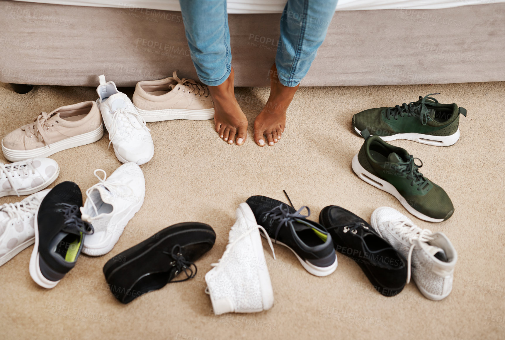 Buy stock photo Person, shoes and fashion with feet for job, getting ready and dressing for work in the bedroom of home. Sneakers, footwear and choice on carpet for starting day, style and wardrobe decision in house