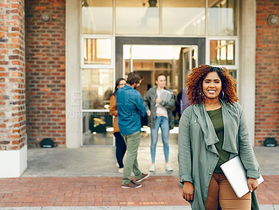 Buy stock photo Portrait of a happy young woman holding a laptop outdoors on campus
