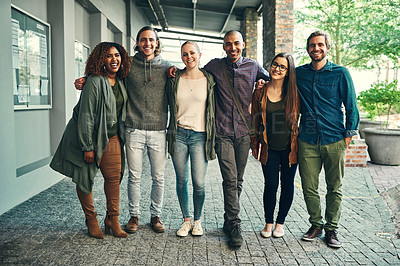 Buy stock photo Portrait of a group of happy young students standing together outdoors on campus