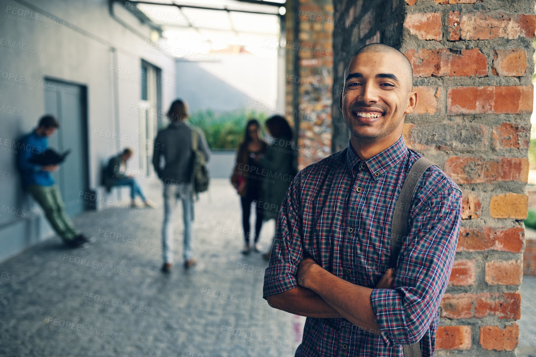 Buy stock photo Portrait, university student and man with arms crossed, knowledge and learning for scholarship with confidence. Face, happy person or guy with education, school or brick wall with college or pride