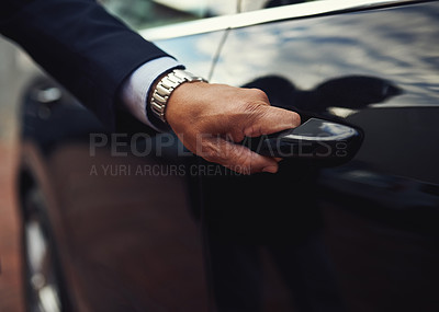 Buy stock photo Cropped shot of a businessman opening a car door
