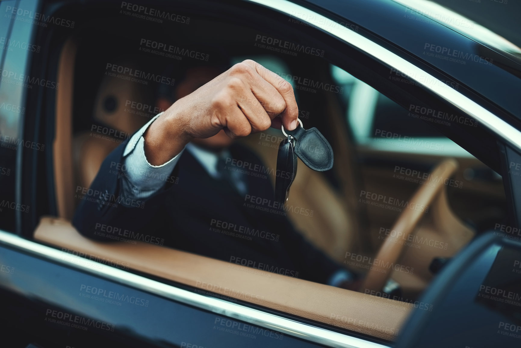 Buy stock photo Shot of a businessman holding the keys to a luxury car