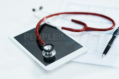 Buy stock photo Hospital, documents and tablet with stethoscope on desk for medical website, telehealth and research. Healthcare, cardiology and digital tech, equipment and clipboard for online consulting service