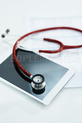 Buy stock photo Hospital, telehealth and tablet with stethoscope on desk for medical website, healthcare and research. Documents, cardiology and digital tech, equipment and clipboard for online consulting service
