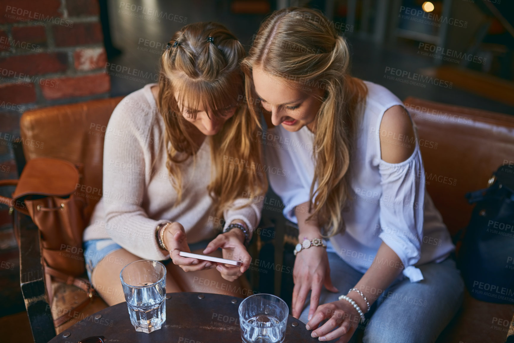 Buy stock photo Coffee shop, friends and women with phone happy  in restaurant for internet, social media and relax. Cafeteria, cafe and people on smartphone for website, online and chat with beverage and drink