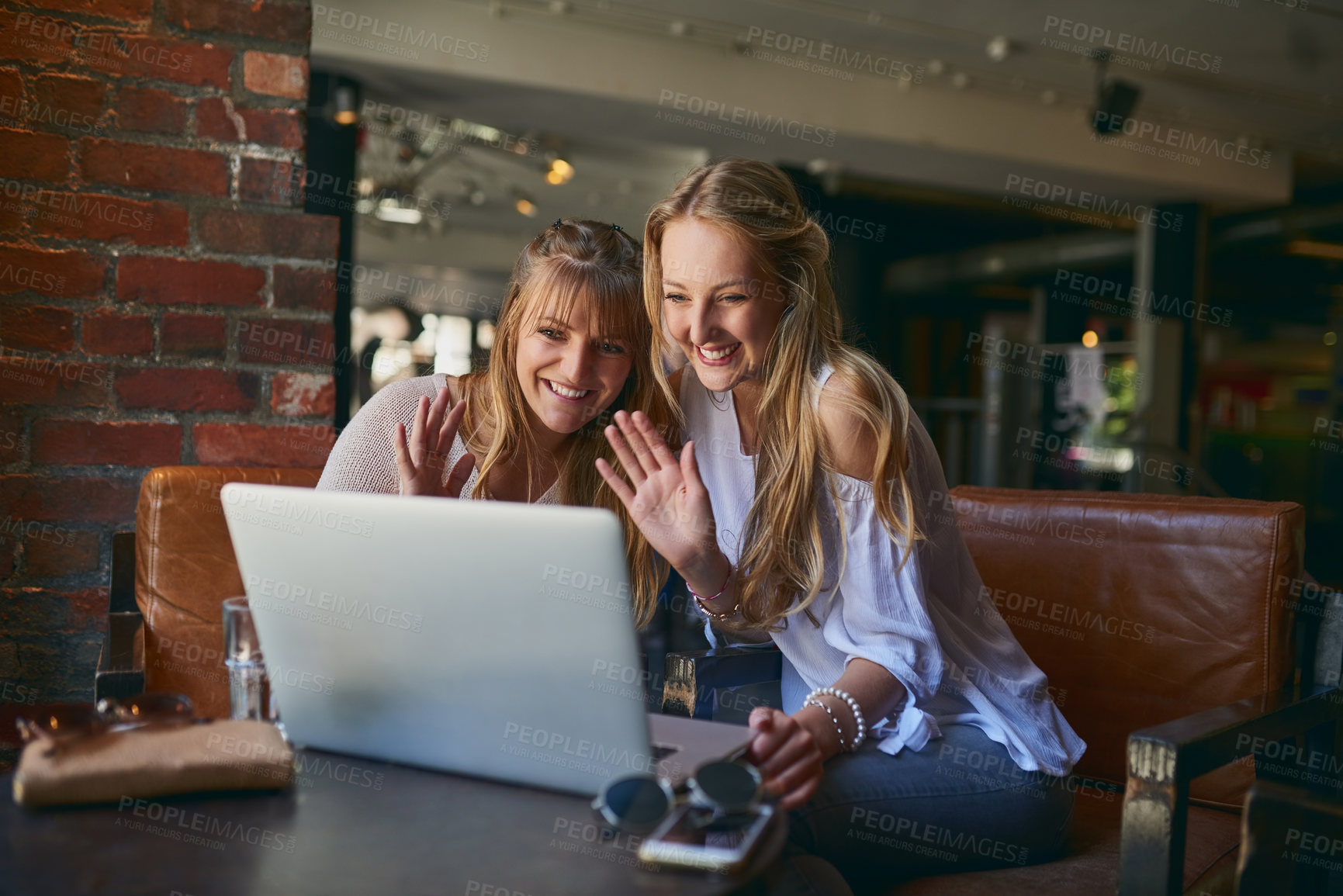 Buy stock photo Happy women, wave and video call with laptop at cafe for communication, greeting or virtual chat. Young, female person or friends with smile on computer or technology in online meeting at coffee shop