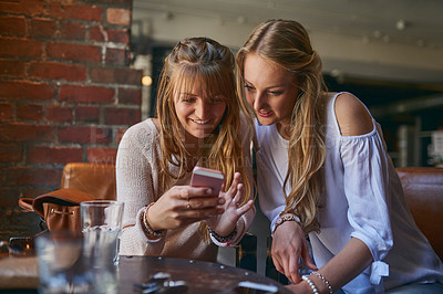 Buy stock photo Coffee shop, relax and women with phone, happy in restaurant and internet for social media and bonding. Cafeteria, smile and people on smartphone for website, online and chat with beverage and drink