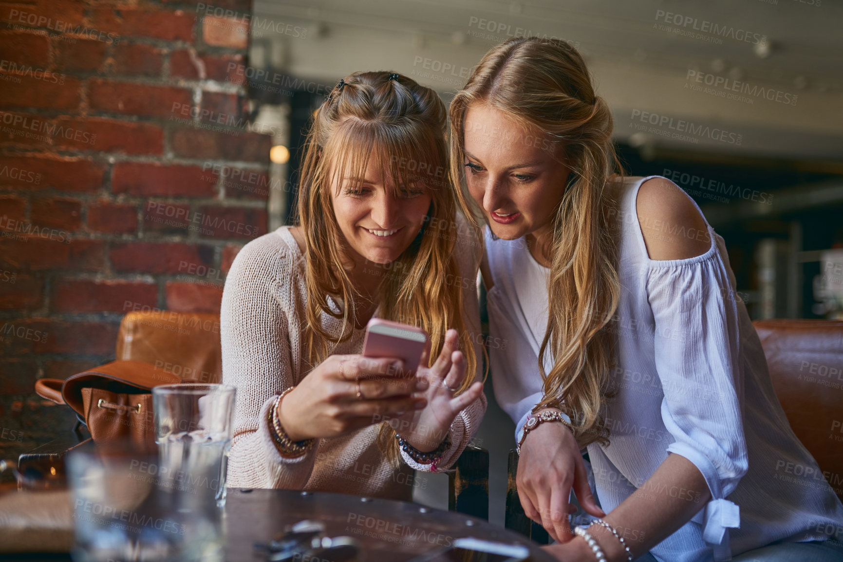 Buy stock photo Coffee shop, relax and women with phone, happy in restaurant and internet for social media and bonding. Cafeteria, smile and people on smartphone for website, online and chat with beverage and drink