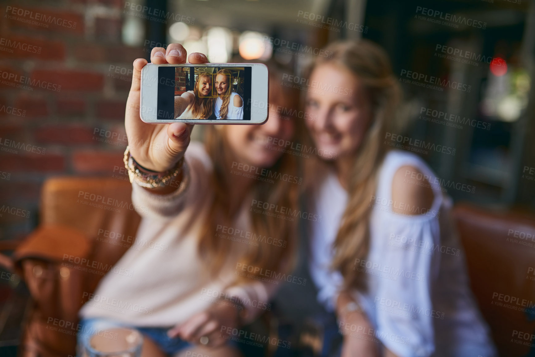 Buy stock photo Phone screen, women and selfie of happy friends in cafe for relax, hangout or meeting. Girls, mobile and picture in coffee shop for vlog, blog post or memory of influencer with hand closeup together