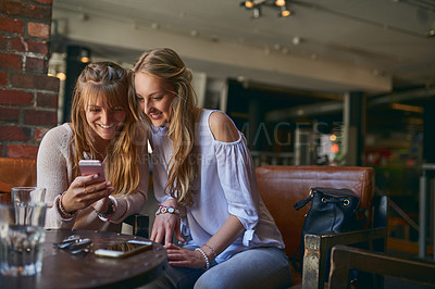 Buy stock photo Coffee shop, friends and women with smartphone happy in restaurant for internet, social media and website. Cafeteria, relax and people on a phone for bonding, conversation and chat with beverage