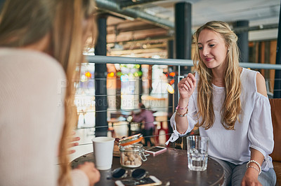 Buy stock photo Friends, relax and talking in coffee shop for social, reunion and bonding together with water by table. Women, communication and support in cafe for conversation, lunch break or girls date on weekend