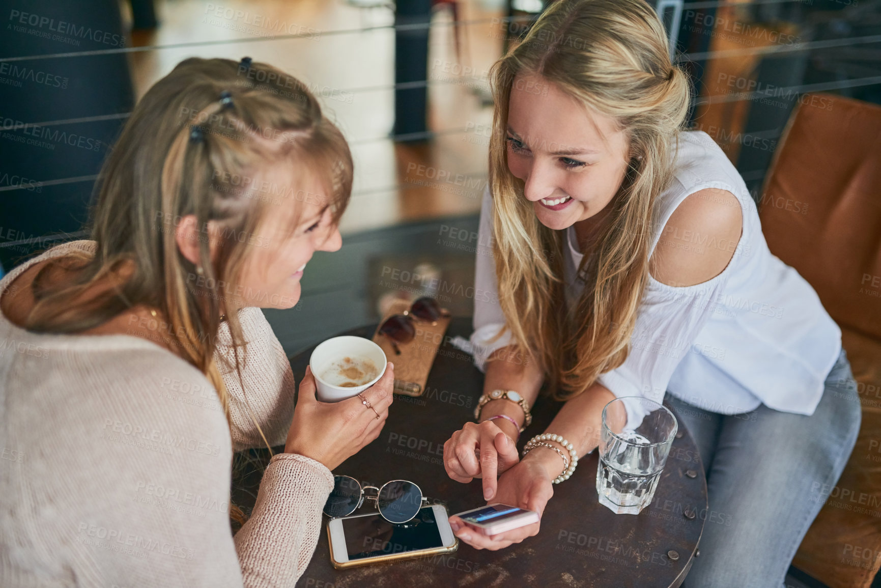 Buy stock photo Restaurant, friends and women with smartphone happy in coffee shop for internet, social media and website. Cafeteria, relax and people on a phone for bonding, conversation and chat with beverage