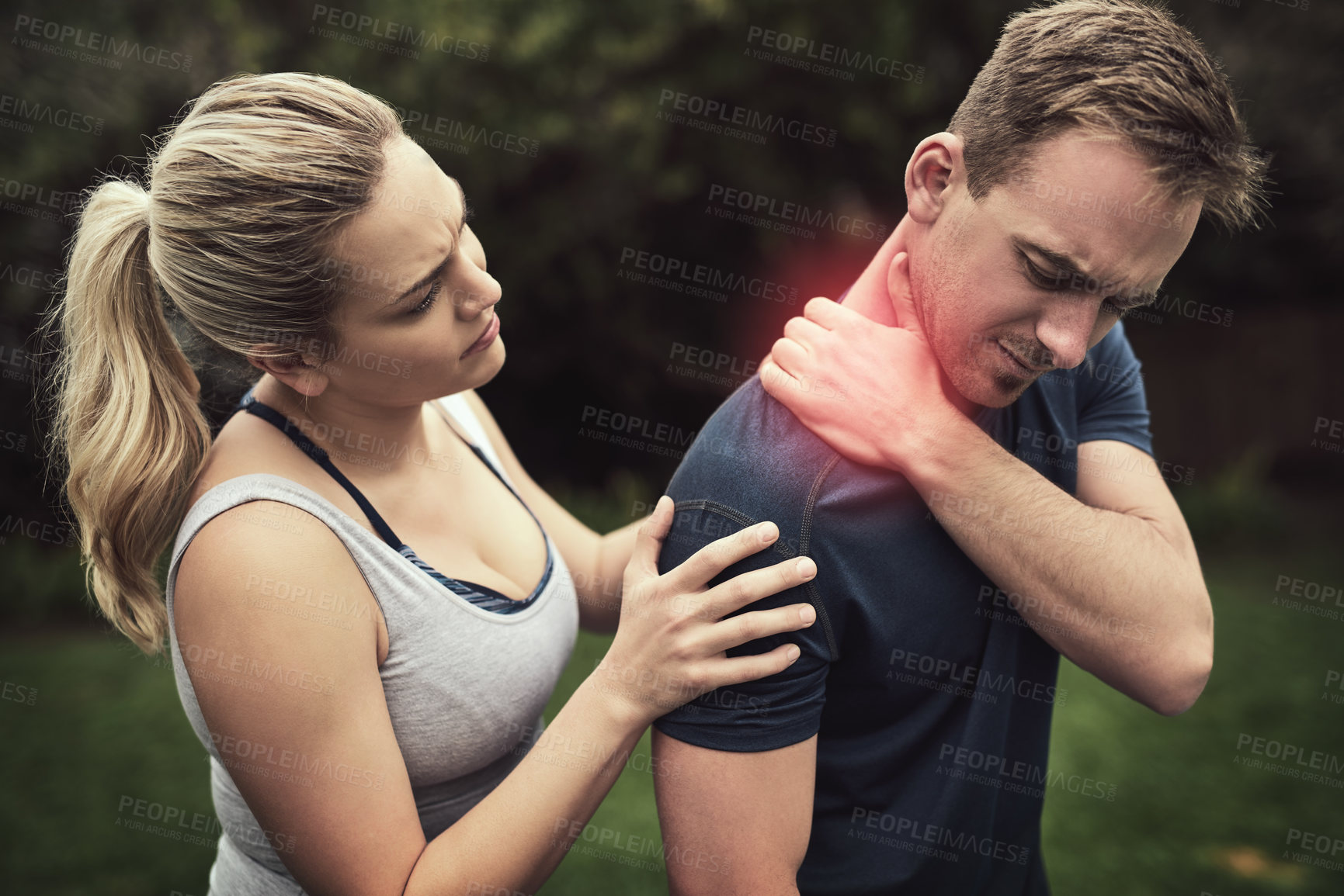 Buy stock photo Fitness, couple and outdoor with shoulder pain for training, workout and exercise in Germany. People, relationship and red glow for injury in garden with help, support and care for muscle ache