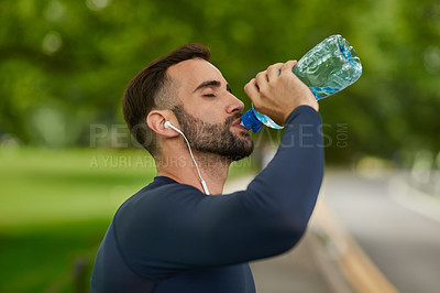 Buy stock photo Man, music or drinking water in park for fitness, hydration or thirsty in exercise. Rest, bottle or athlete in nature for health, aqua or training outdoor with electrolytes for energy in Portugal